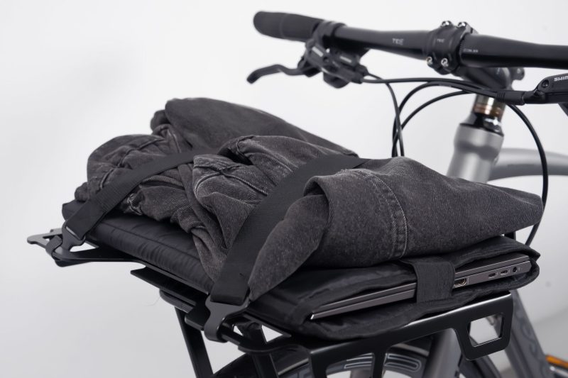 TRAYC AVS Loading Plate in black carrying a bag